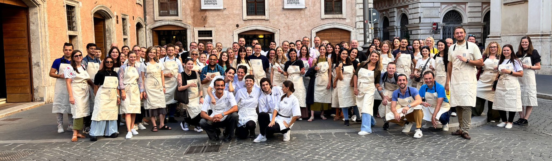 Large group of guests outside a cooking class in central Rome