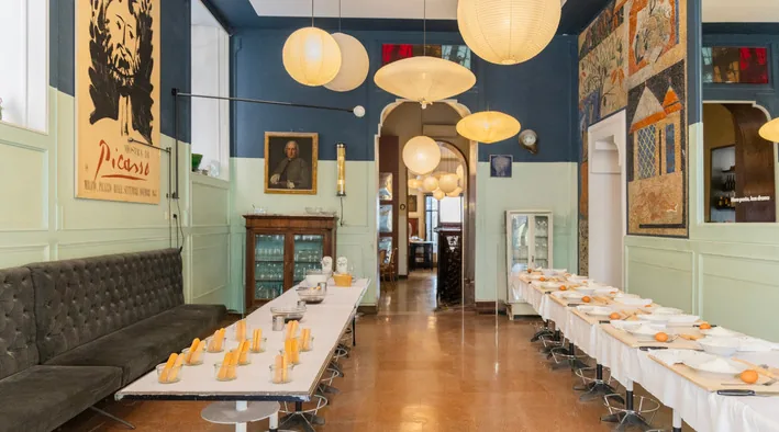 Long table set for a group in the blue room