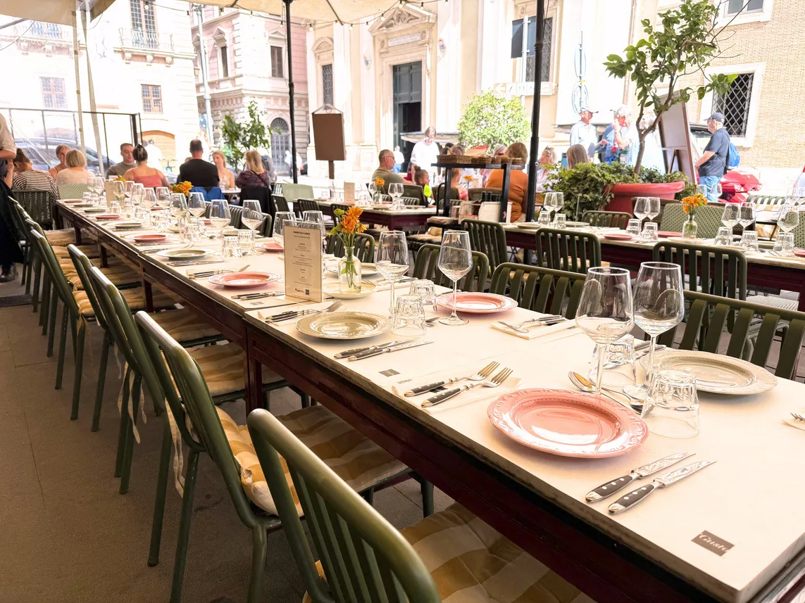 Outdoor table set for a group in central Rome