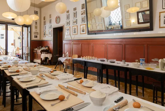 Wood-panelled room set for a group dinner